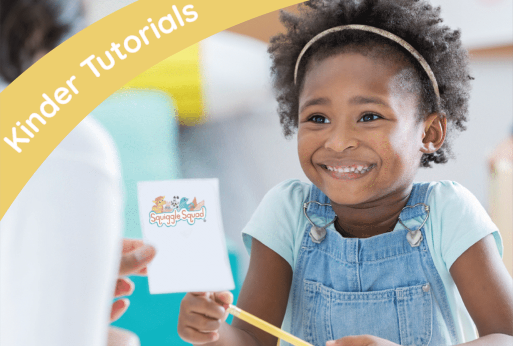 A child with curly hair, wearing a light blue shirt and denim overalls, smiles while holding a card with the "Squiggle Squad" logo. A person in the foreground reaches toward the child. Text: "Kinder Tutorials.